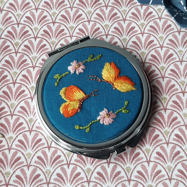 Miroir papillons orangés